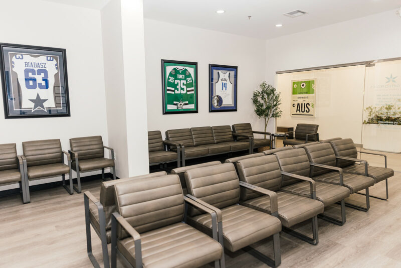 Patient waiting room with framed signed jerseys at Star Orthopedics