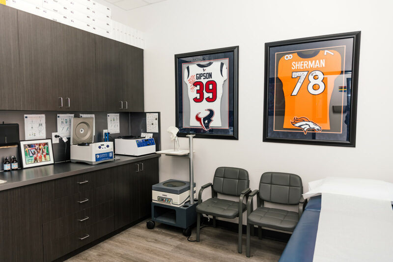 Procedure room at Star Orthopedics with framed signed jerseys